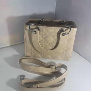 New nude patent leather top handle handbag